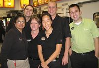 Joel Serna, Manager, Chik-fil-A, and some of the staff.